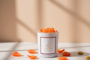 Sacred Garden candle with orange rose petals